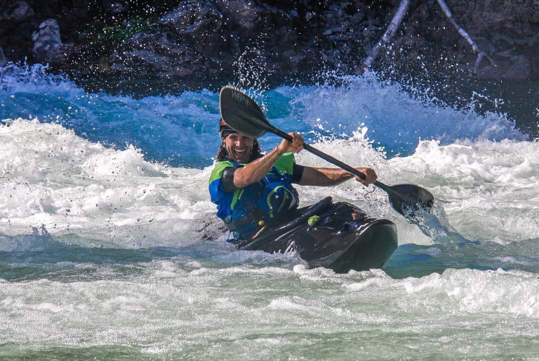 Waka Kayak in the white water, happy paddler